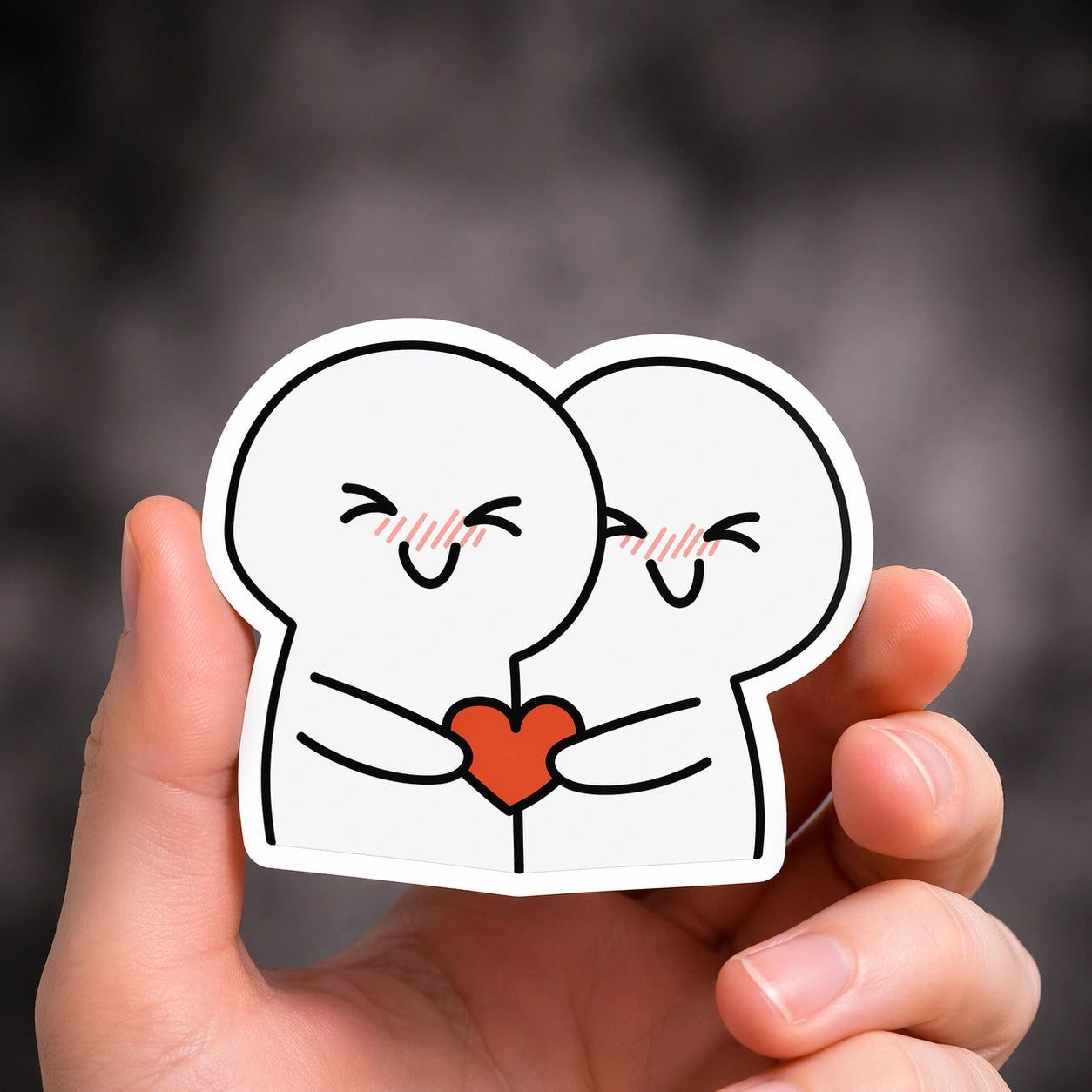 Minimalistischer Sticker mit zwei süßen Figuren, die gemeinsam ein Herz halten
